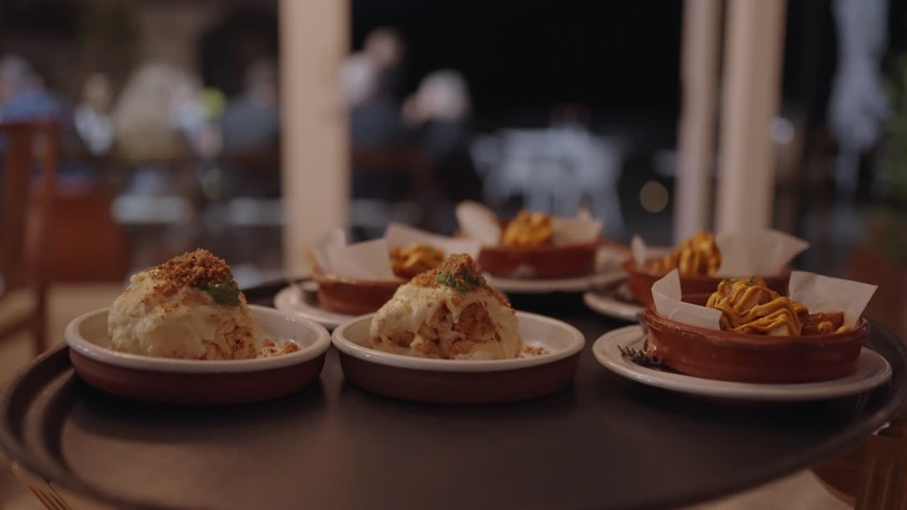 Numerous portions of delicious food waiting to go out to customers at a restaurant