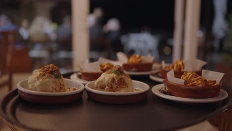 numerous portions of delicious food waiting to go out to customers at a restaurant