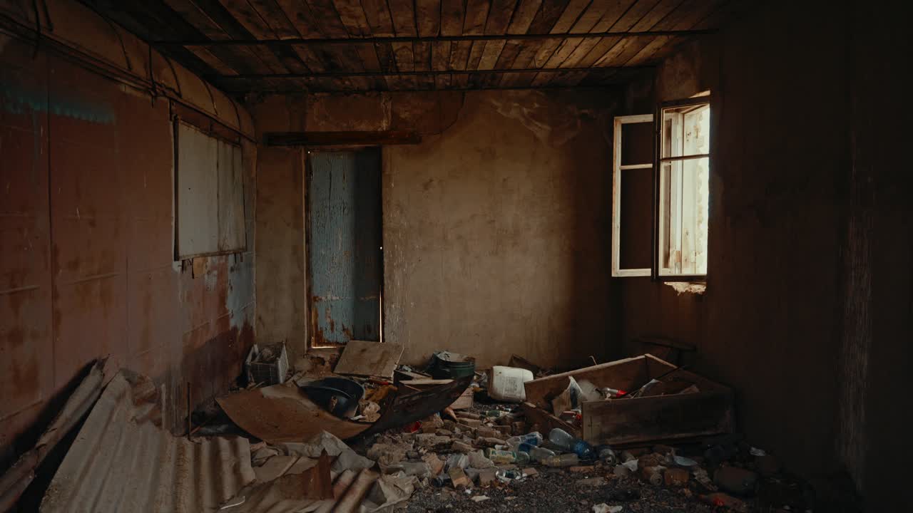 Interior of an Abandoned and Ruined Room with Debris