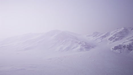 aerial landscape of snowy mountains and icy shores in antarctica