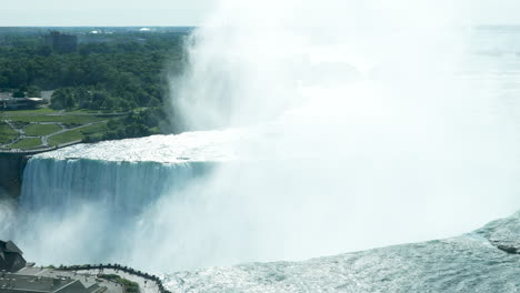 A-medium-shot-of-mist-rising-over-Horseshoe-Falls-in-Niagara-Falls,-Ontario