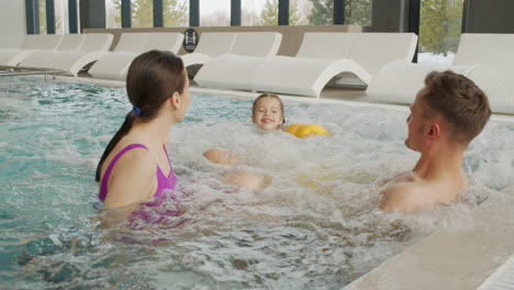 family enjoying a hot tub spa day