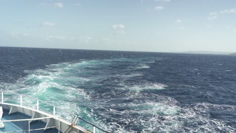 azure colour water left after ferry sailed past mediterranean sea in malta