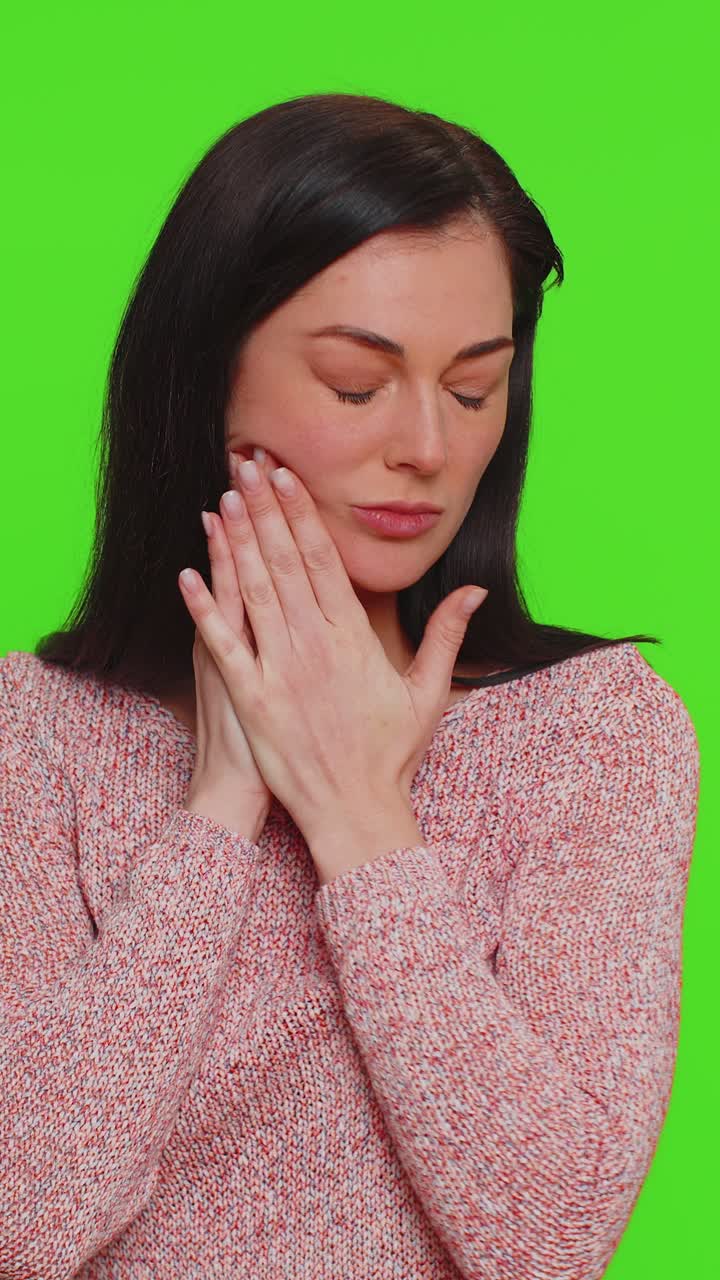 Woman touching cheek suffering from toothache cavities or gingivitis waiting for dentist appointment