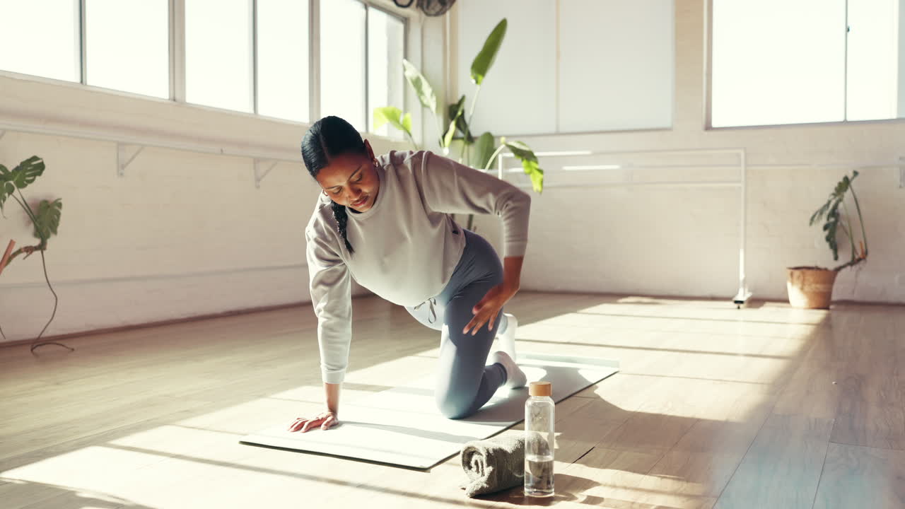 Woman practicing yoga indoors