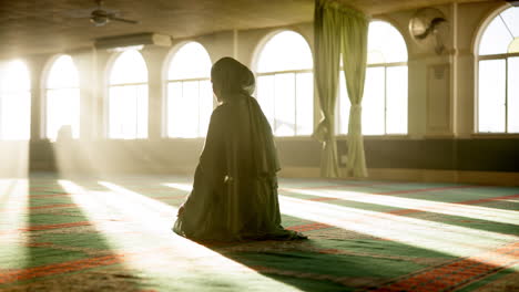 muslim prayer in mosque with sunlight