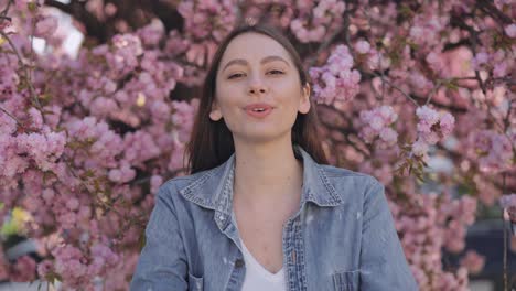 woman enjoying cherry blossoms