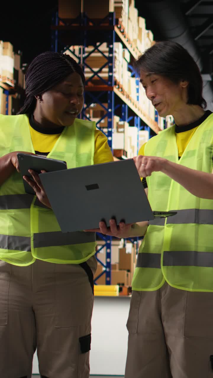Vertical Video Multiethnic staff processing e-commerce orders and reviewing invoices