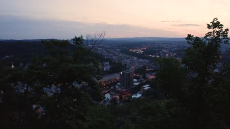 reverse reveal shot of a beautiful small town in europe at sundown