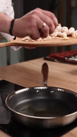 cooking chopped mushrooms in a pan