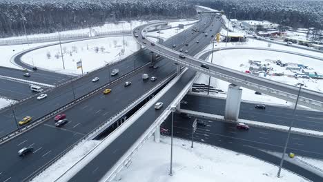 aerial view of a freeway intersection snow-covered in winter.