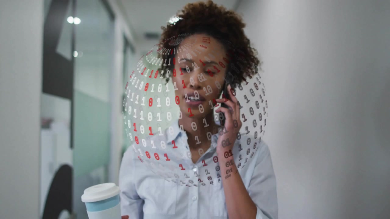Businesswoman Walking in Office Hallway Talking on Phone with Digital Data Overlay