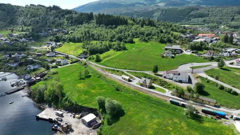 Railway-museum-and-old-decommisioned-track-and-locomotive-in-Garnes-Norway,-Aerial