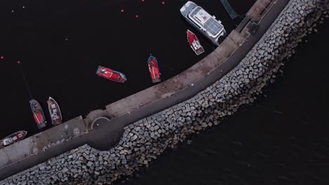 aerial top down shot of red fishing port arriving harbor of punta del este beach in uruguay