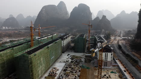 chinese yangshuo city residential building construction, 4k aerial view