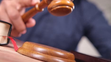 judge striking the gavel in courtroom