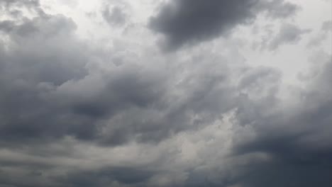 Mid-afternoon-thunderstorm-rain-clouds-forming-and-blending-across-the-african-horizon-time-lapse,-noise-free-4k-footage