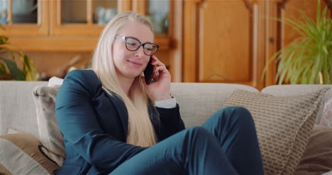 Young-Businesswoman-Talking-On-Mobile-Phone