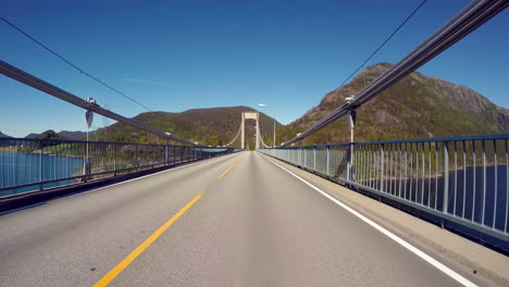 vehicle point-of-view driving over the bridge.