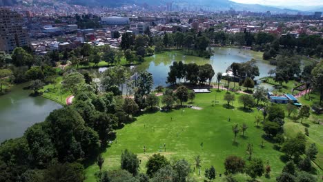 bogota, colombia. aerial view of parque de los novios, lake and green grass on sunny day