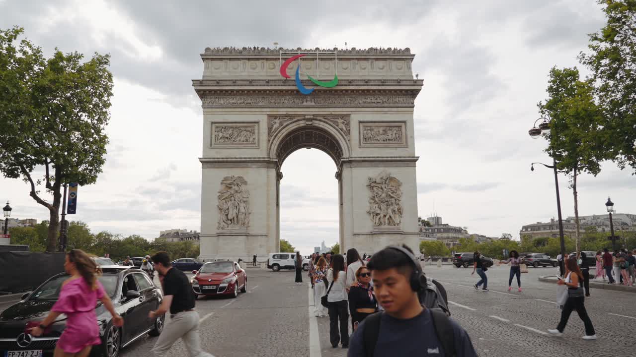 Arc de Triomphe in Paris with Paralympic Symbol on a Cloudy Day
