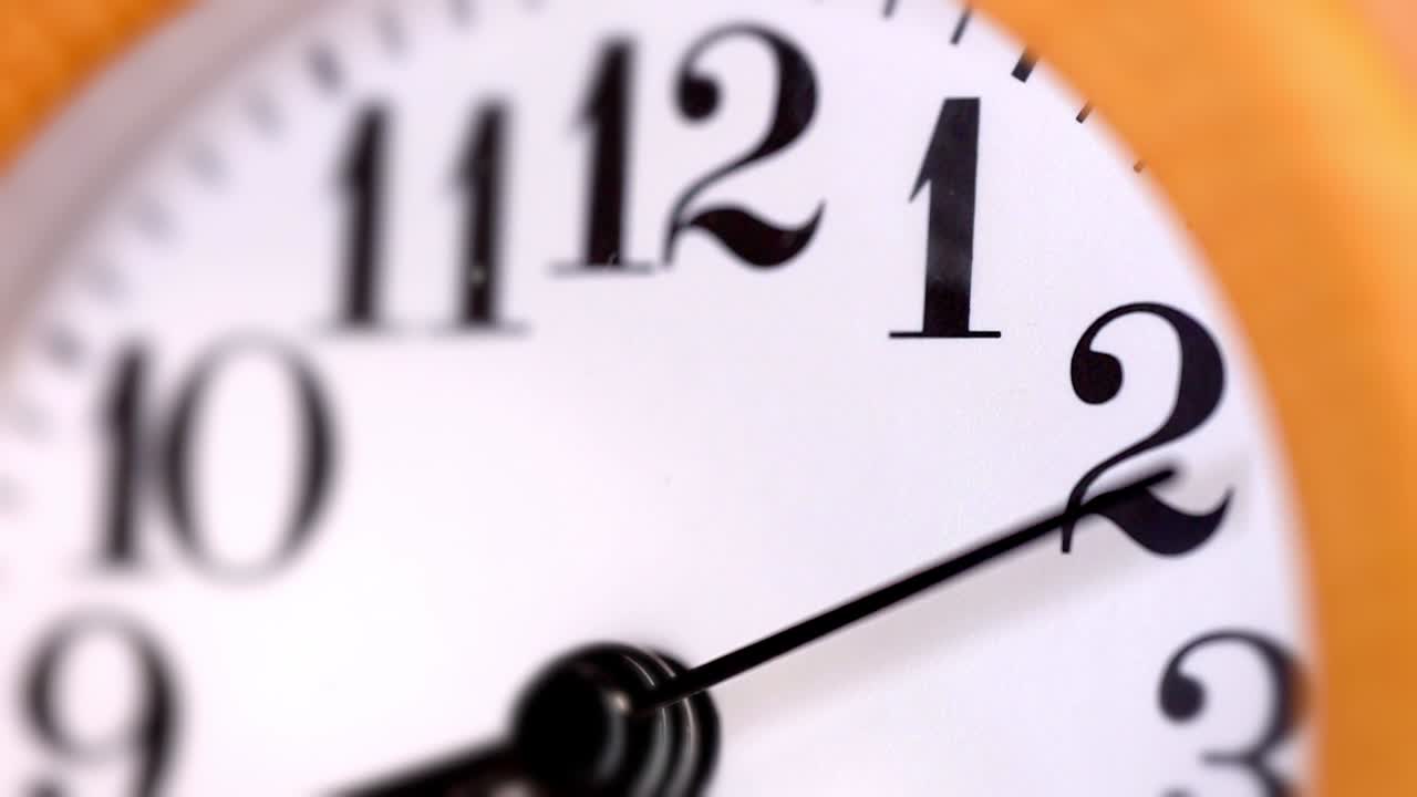 Wooden round clock. Close-up view.