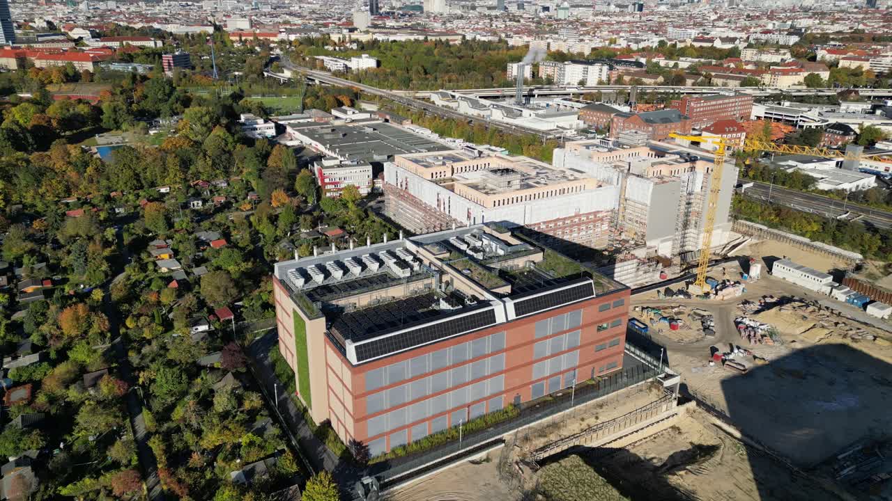 biggest data center building providing cloud computing services in an urban city. blockchain digital database, internet security for sensitive data. Amazing aerial view flight static hovering drone