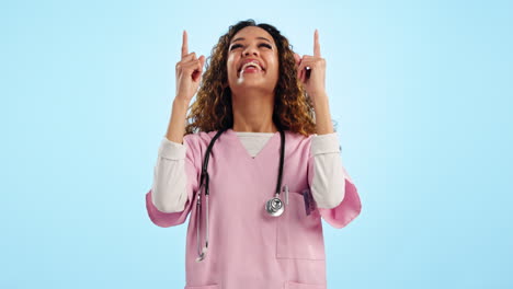 Studio,-happy-woman-or-doctor-pointing-up