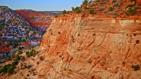 Aerial flyover showcasing the intricate geology of red rock canyon’s sculpted walls.