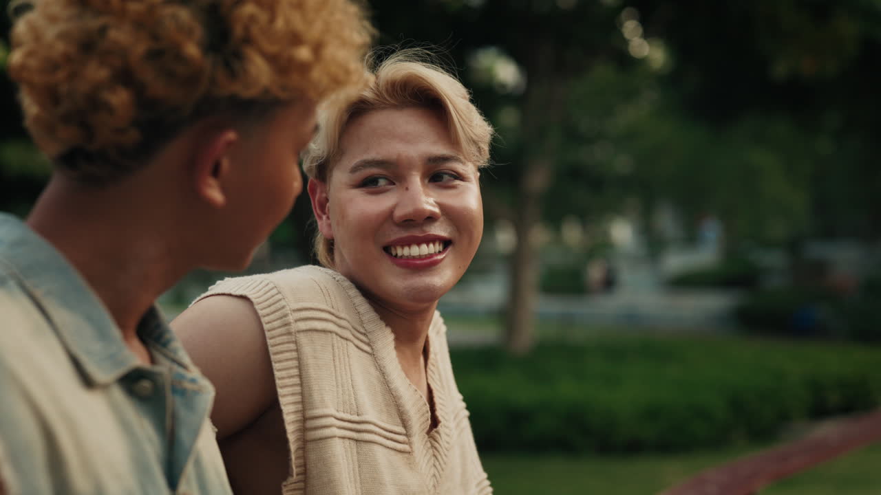 Two people in park showing affection