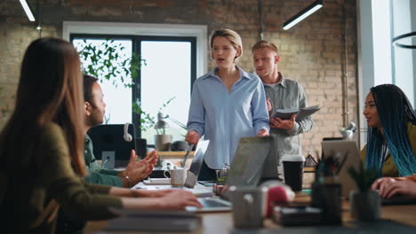 businesswoman brainstorming office team in boardroom. boss asking work results