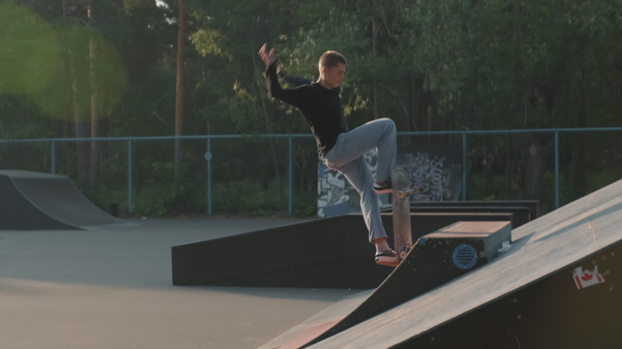 Guy Skating on Ramp in Skatepark