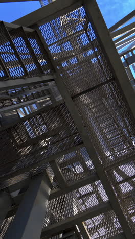 steel construction of modern factory. modern storehouse construction with metal structures of frame. structural steel structure of new commercial building. vertical video