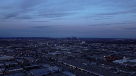 Nighttime-flight-from-industrial-zone-towards-Downtown-Calgary