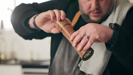 chef preparing a dish with spices