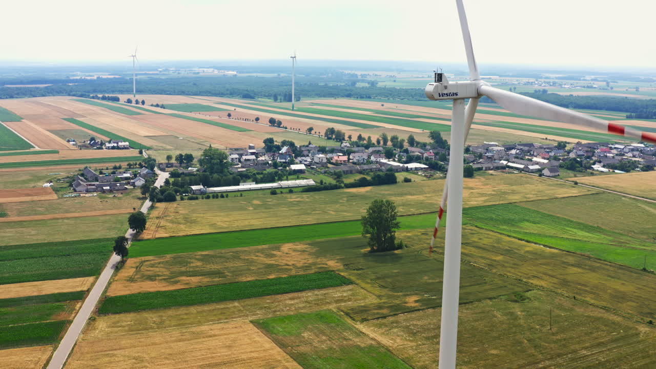 Wind Turbines In The Farm Near The Village. - aerial shot