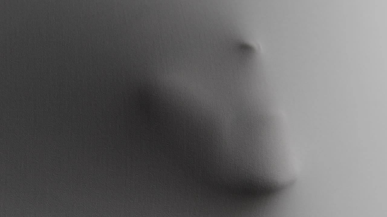 Creepy silhouettes of a woman's hands appears from the white surface