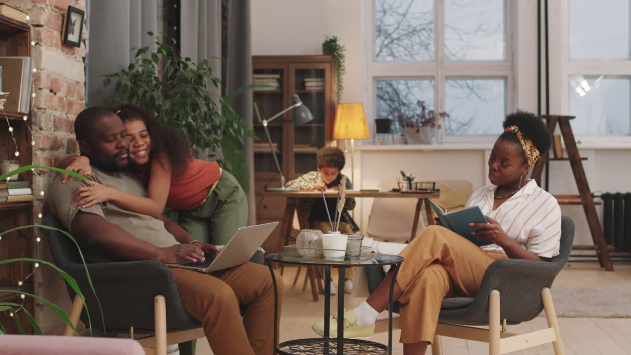 Happy Afro-American Family Of Four At Home
