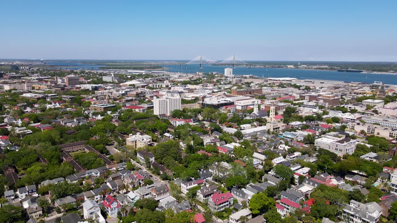 Charleston South Carolina Colonial Lake Park with Cooper River Bridge in background dolly forward shot