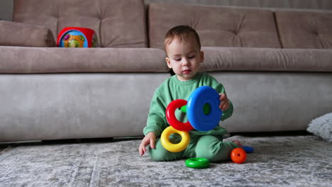 baby playing with stacking rings