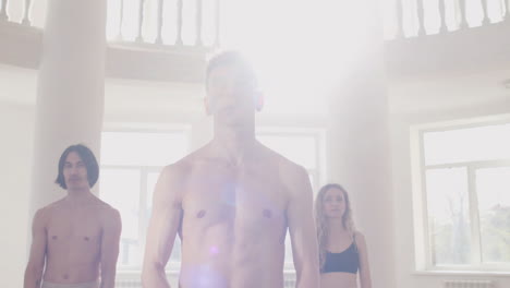 Close-Up-Of-Male-Dancer-Training-Looking-At-Camera-In-The-Studio