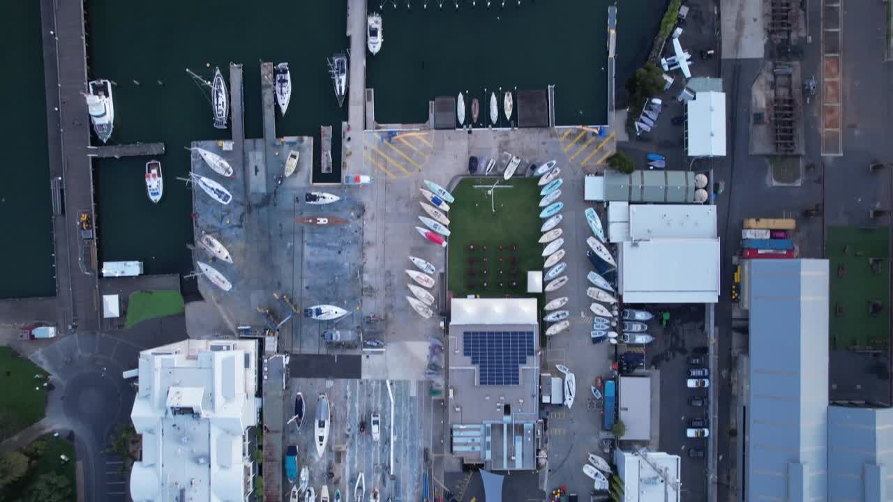 Top down aerial view over the Marina in Williamstown with boats aligned on dock