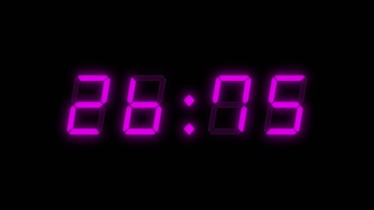 4-digit, 30 second digital clock countdown timer. Magenta or purple numbers on black bg. Digital alarm clock with flashing red warning light