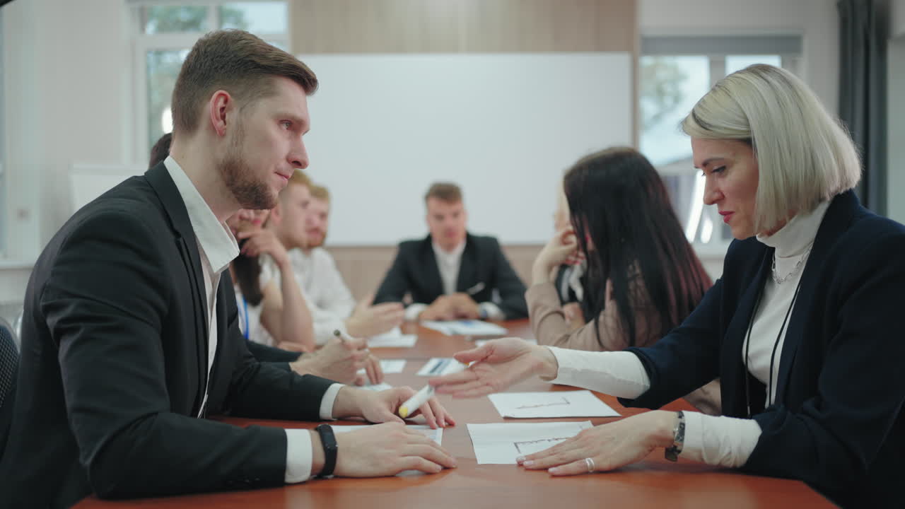 financial and marketing specialists are communicating in business meeting in conference hall