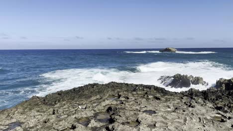 A-breathtaking-view-of-the-vast-blue-ocean-captured-from-the-rugged,-rocky-shoreline