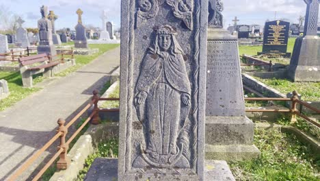 Cemetery-near-Waterford,-amazing-handcrafted-cross-on-a-very-old-headstone,-work-of-a-very-gifted-stonemason