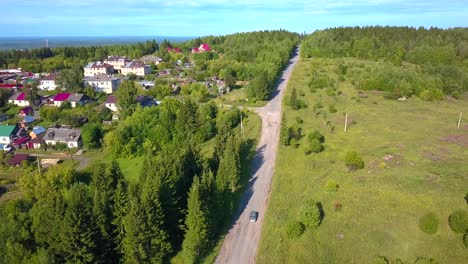 aerial view of a small village and country road