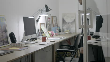 beautiful woman designer working in front of a computer with glasses