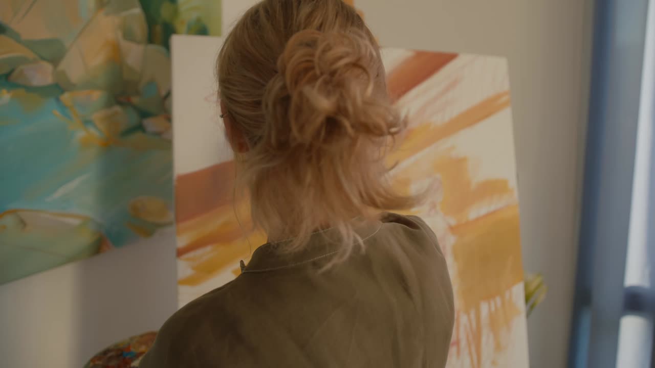 Female Artist Painting in her Studio