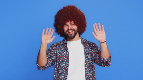 happy man smiling friendly waving hands gesturing hello greeting or goodbye meeting invitation